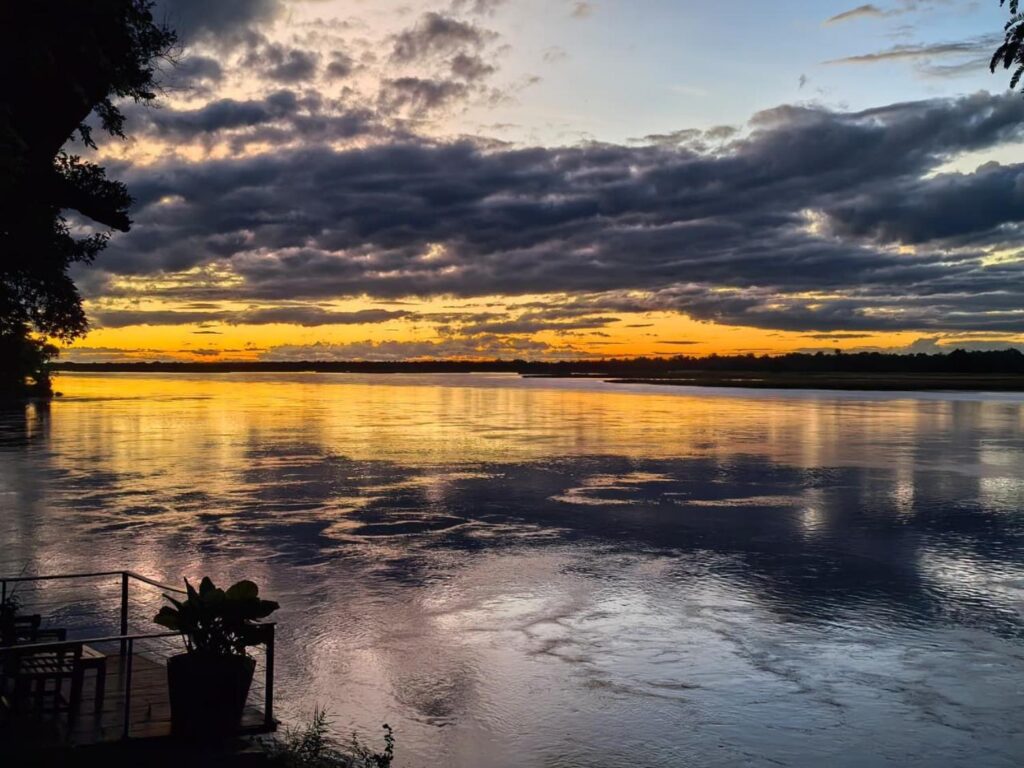 Sunset over the Zambezi River and Mana Pools shoreline from Baines' River Camp, Lower Zambezi